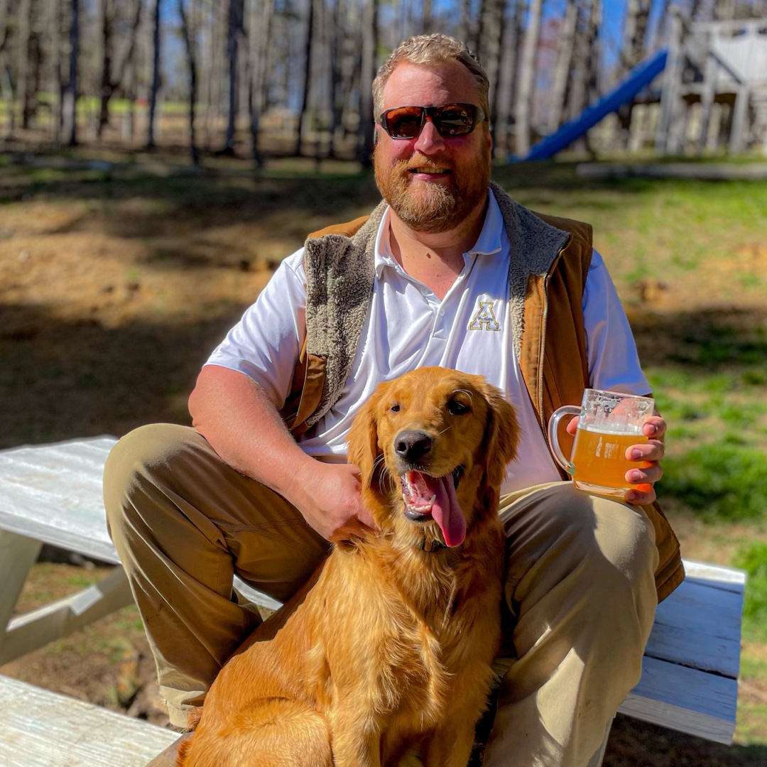 Andrew Plyler with Luna his golden retriever at a local brewery