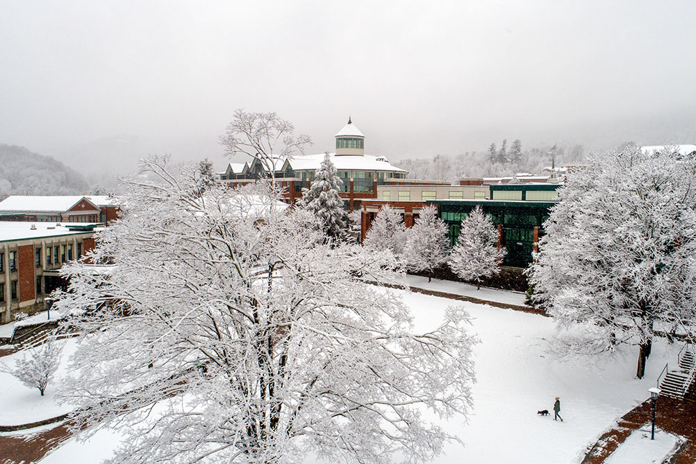 A newly built mountain home alongside a classic existing cabin in the Boone NC High Country