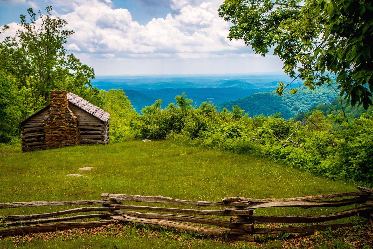 Summer view of the Blue Ridge Mountains near Boone NC with green rolling peaks under a clear blue sky