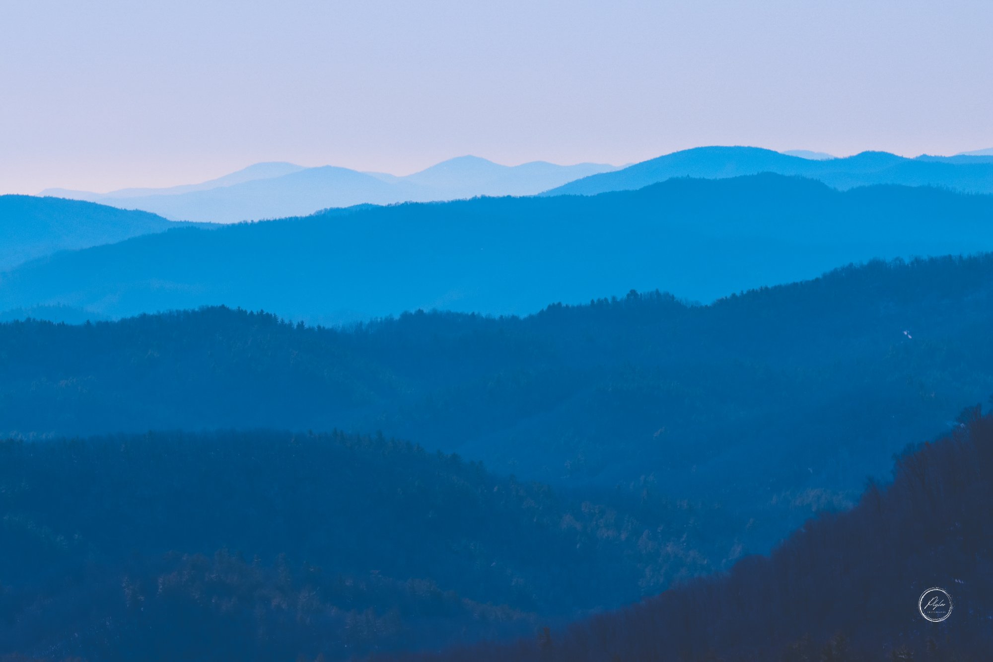 Layered Blue Ridge mountain ridgelines at dusk — NC High Country